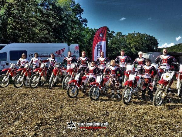 Event ideas: female and male riders and children posing with their Honda bikes next to the van