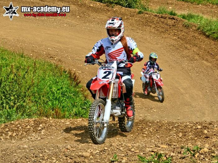 Female motocross riders: a woman with race number 2 heads towards the next corner