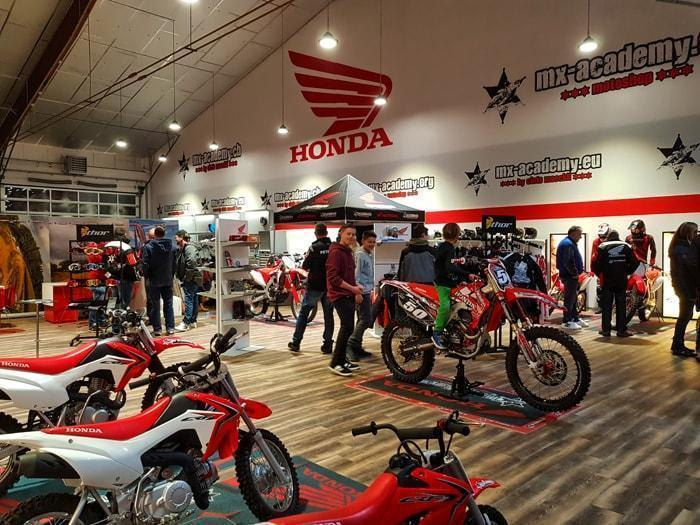 Honda shop as official Honda outlet: visitors looking at the motocross bikes in the Honda Motoshop