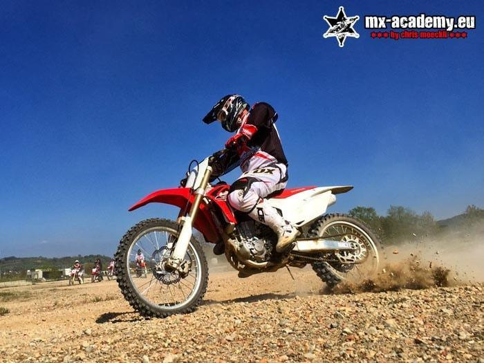 Motocross taster course: a beginner rides a Honda across the gravel track