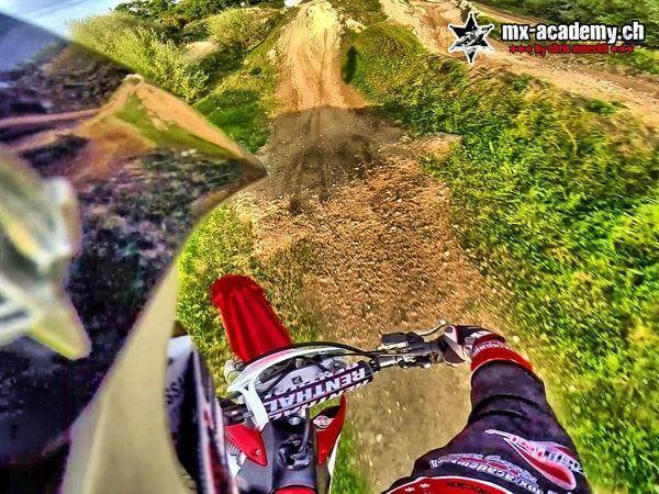 MX photos from the helmet camera: looking over the handlebars towards a jump mound