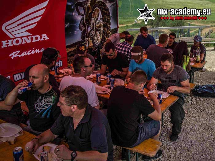 Team event over: the group sits together comfortably over a shared meal afterwards